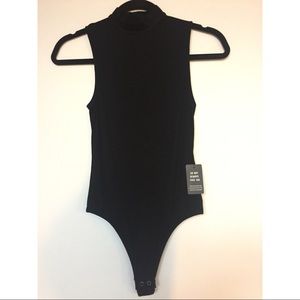 Express ribbed mock neck thong bodysuit